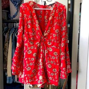 Red flowered romper with flare sleeves